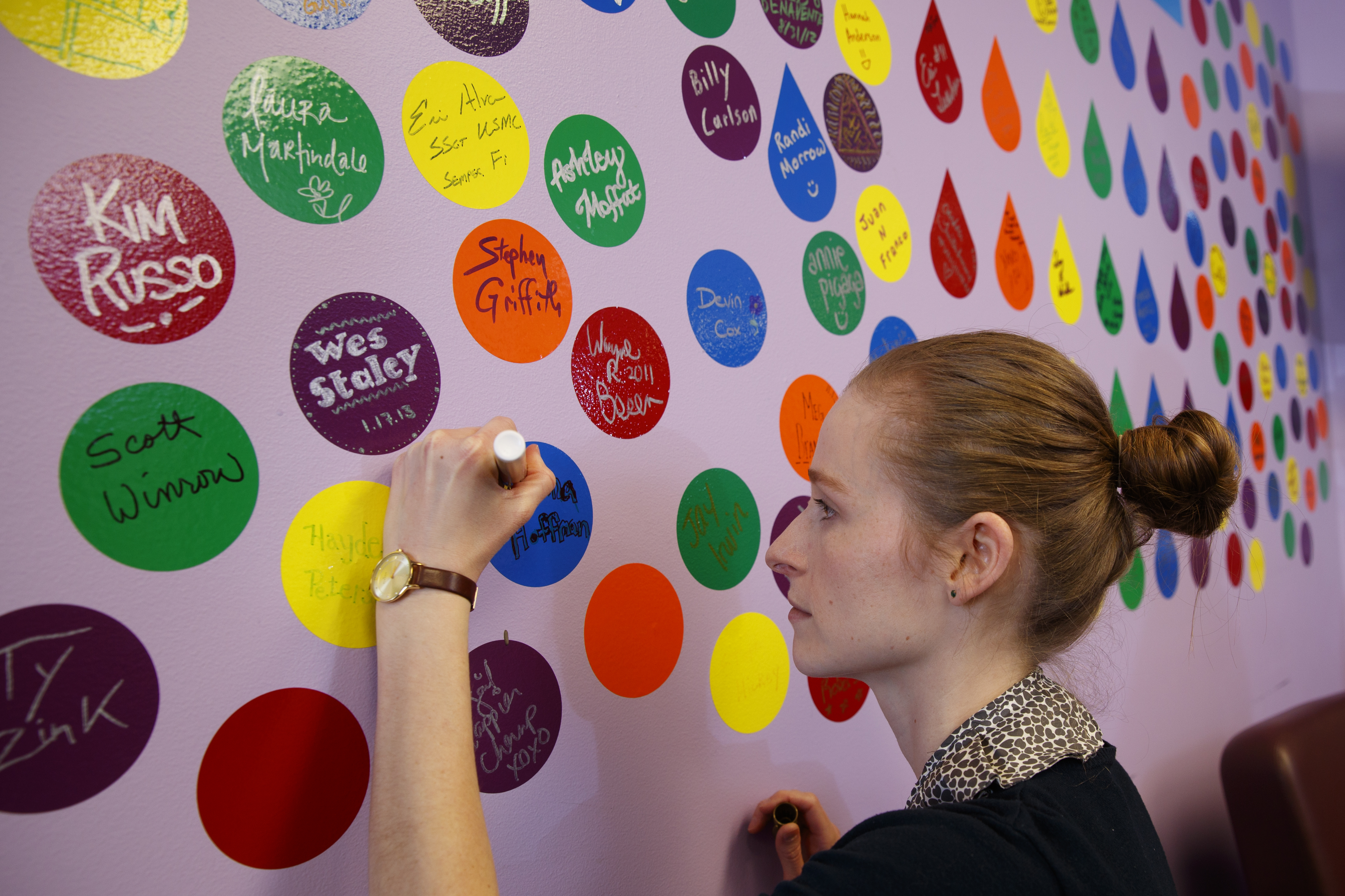 woman writing on wall in a circle