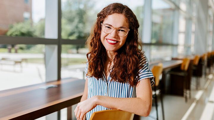 Photo of Taylor Jarvis in Hawks Hall, which is home to the College of Business.