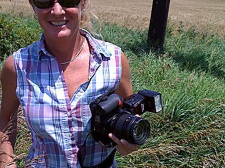kelly erisman standing with camera